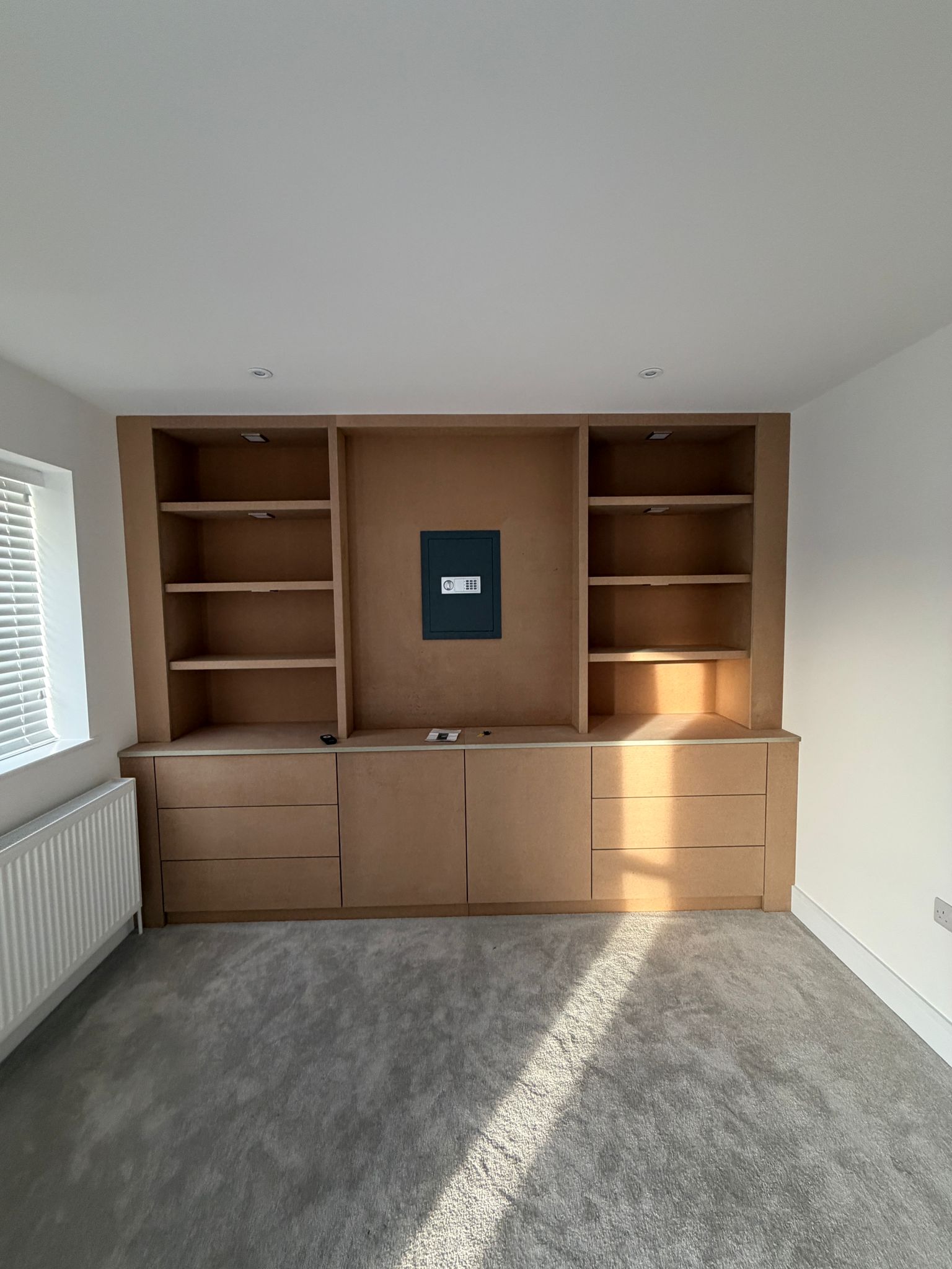 Before — fitted shelving unit raw MDF